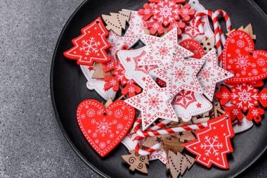 Gingerbread, Christmas tree decorations, dried citrus fruits on a gray concrete background to prepare a festive Christmas table