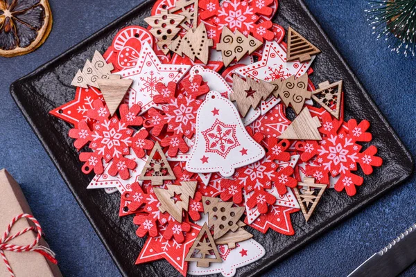 Christmas decorations and gingerbreads on a dark concrete table. Preparing and decorating the house for holiday