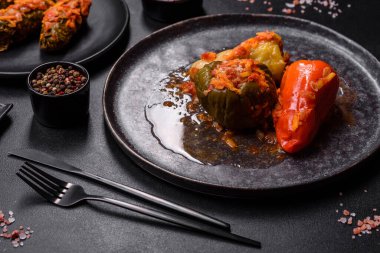 Dolma, stuffed grape leaves with rice and meat on a dark background. Caucasian and Turkish cuisine