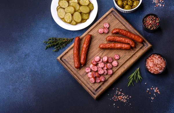 Delicious Fresh Smoked Sausages Cut Slices Wooden Cutting Board Dark — Stock Photo, Image