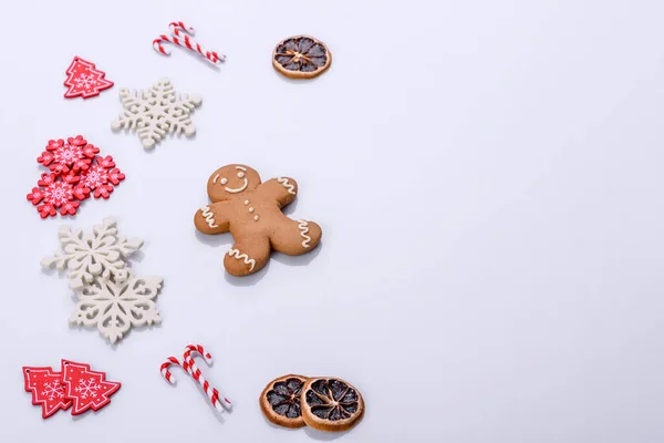 Elements of Christmas scenery, toys, gingerbread and other Christmas tree decorations on a white background. Preparing for the holiday