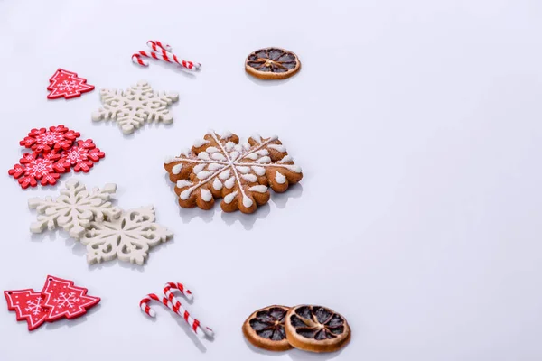 Elements of Christmas scenery, toys, gingerbread and other Christmas tree decorations on a white background. Preparing for the holiday