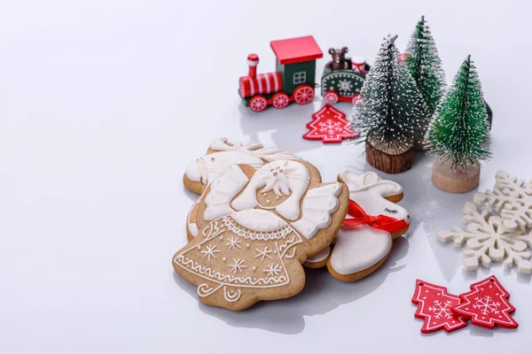 Elements of Christmas scenery, toys, gingerbread and other Christmas tree decorations on a white background. Preparing for the holiday