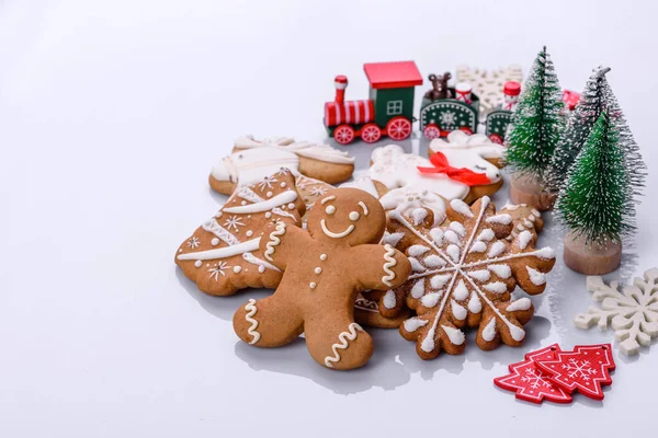 Elements of Christmas scenery, toys, gingerbread and other Christmas tree decorations on a white background. Preparing for the holiday