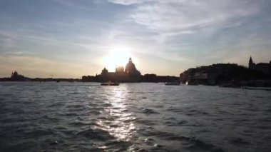 Europe, Italy, Venice November 2021 - sailing with the boat on the Grand Canal in Venice during sunset, gondolas and boats in the Venice lagoon