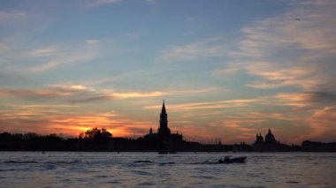 Europe, Italy, Venice November 2021 - sailing with the boat on the Grand Canal in Venice during sunset, gondolas and boats in the Venice lagoon