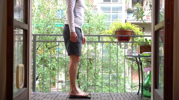 Sportive Man Years Old Measure Weight Home Balcony Sports Activities — Vídeo de Stock