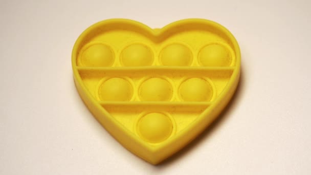 Heart Shaped Yellow Antistress Baby Push Bubble Simple Dimple — Stock videók