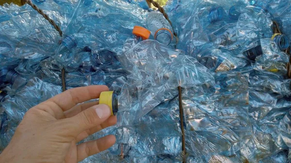 Plastic bottles collected in the sea and stacked for recycling - plastic island in the oceans - climate change and human-caused environmental pollution - green revolution and Save the planet