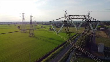 Italy Drone view of Power Plant in Lacchiarella near Milan in the Po Valley- High voltage pylons for the production and transport of energy - energy crisis to increase gas costs and petrol oil energy  
