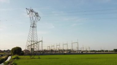 Italy Drone view of Power Plant in Lacchiarella near Milan in the Po Valley- High voltage pylons for the production and transport of energy - energy crisis to increase gas costs and petrol oil energy 
