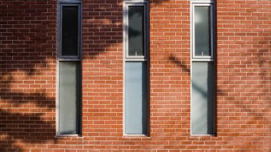 Kırmızı tuğla duvar dokusunun arka planı. Kırmızı tuğla duvarın ev ya da ofis tasarımı deseni.