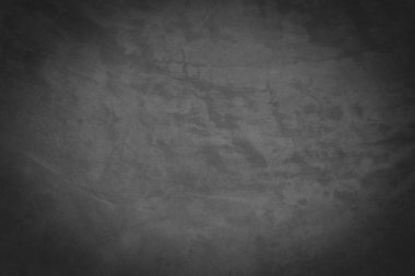 Yüzeyinde çatlaklar olan eski gri beton duvar..