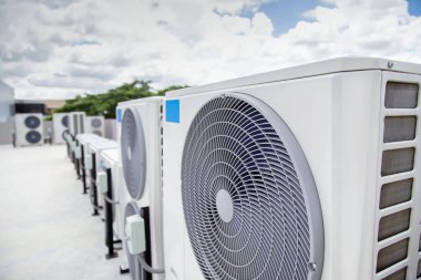 Air conditioner compressor installed outdoors.