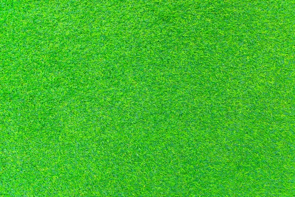 Green wall and green background of artificial grass designed for outdoor sports and business related to sports.