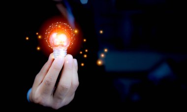 Businessman Touching Icon Bulb.Concept of Ideas for success.Concept with innovation inspiration.Success start from new ideas to innovative technology relying on information from the internet big data