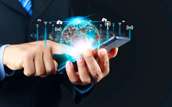 5G Technology networks Internet connecting wireless devices around the world. 5G technology is essential to businesses in the digital world with smartphones in hand and icons connected to each other