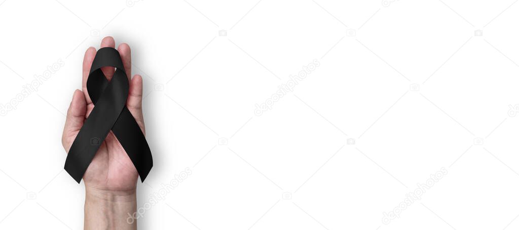 Black Ribbon for Melanoma awareness, skin cancer prevention, and mourning for death loss of victims and terror attack. (Bow isolated on white background with clipping path)