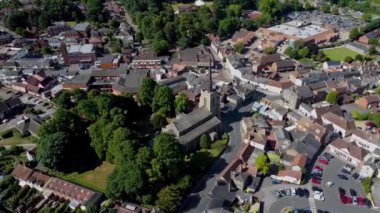 4k video footage of an aerial view of St Peter's and St Mary's Church in the centre of Stowmarket, Suffolk, UK