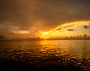 A magnificent orange sunset in Cozumel, Mexico