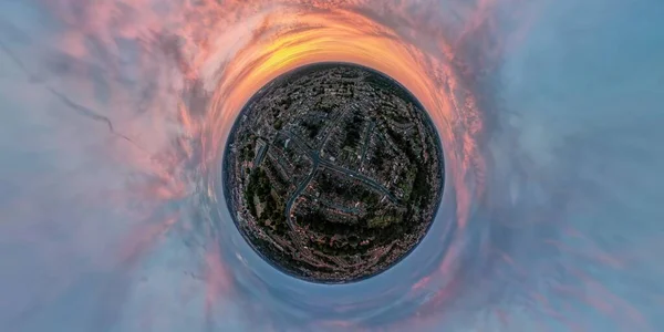 A tiny planet aerial view of Ipswich, Suffolk, UK at sunset
