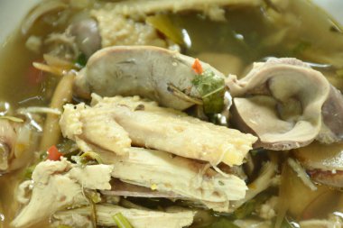 spicy boiled chicken with liver and gizzard Tom Yum Soup on bowl