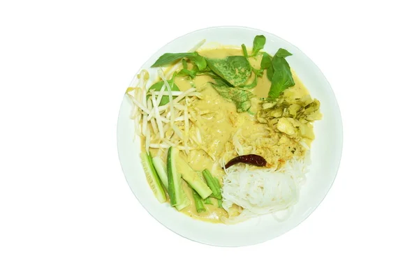 rice noodles dressing crab coconut milk curry sauce and fresh vegetable on plate