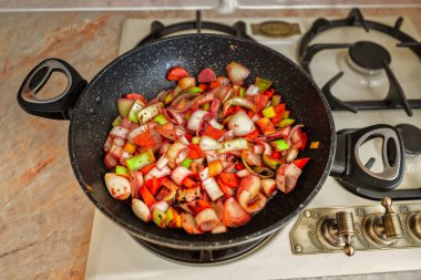 Roasted vegetables mix in a pan. Top view. Vegan charcuterie, vegetarian, seasonal, summer eating concept. 