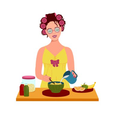 Kafasında bigudi olan kız kahvaltı hazırlar.