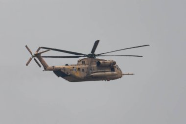 Jerusalem, Israel - May 5th, 2022: An israeli air force Sikorsky CH-53 Sea Stallion helicopter, flying in a hazy sky.