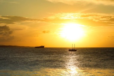 Sunset on the sea of Fortaleza Brazil with silhouette of a shipwreck