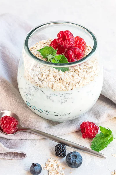 Glass Layered Yogurt Chia Seeds Oats Berries Grey Concrete Tabletop — Stock Photo, Image