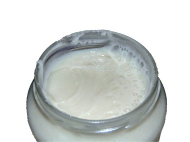 rapeseed honey in a jar - isolated on white