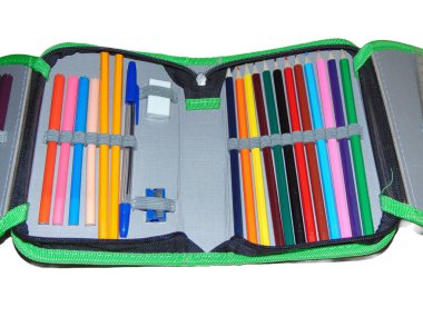 Pencil case with colored pencils, crayons, pen, eraser, sharpener. School concept