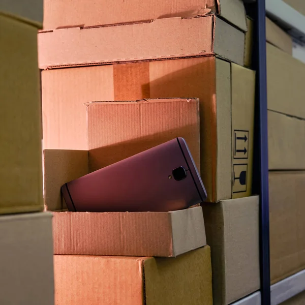 The phone is in an open box in the warehouse, problems with the delivery of electronics