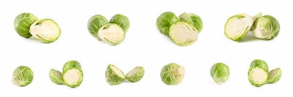 Brussels sprouts. Large set of fresh brussels sprouts in stacks on a white isolated background. Deep focus stacking. — Stock Photo, Image