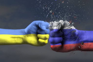 Ukrayna ve Rusya arasındaki savaş. Ukrayna 'nın savaşta kazandığı zafer. Ukrayna 'da askeri operasyon kavramı bayrakların rengine boyanmış iki yumruk birbirine çarptı.