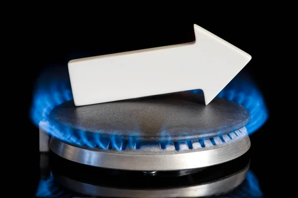 Gas price. Supply chains and the energy gas crisis. Gas stove with a burning flame and a graph arrow pointing up.