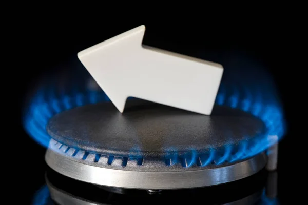 Gas price. Supply chains and the energy gas crisis. Gas stove with a burning flame and a graph arrow pointing up.