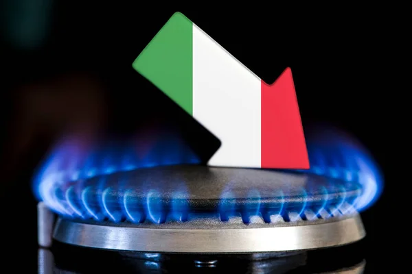 Decreased gas supplies in Italy. A gas stove with a burning flame and an arrow in the colors of the Italy flag pointing down. Concept of crisis in winter and lack of natural gas. Heating season
