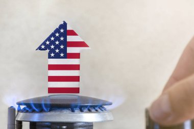 Gas price. Rise in gas prices in United States of America. A burner with a flame and an arrow up, painted in the colors of the USA flag. The concept of rising gas or energy prices