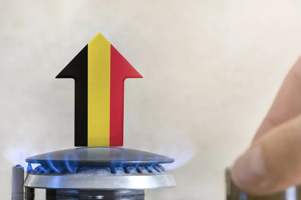 Gas price. Rise in gas prices in Belgium. A burner with a flame and an arrow up, painted in the colors of the Belgium flag. The concept of rising gas or energy prices
