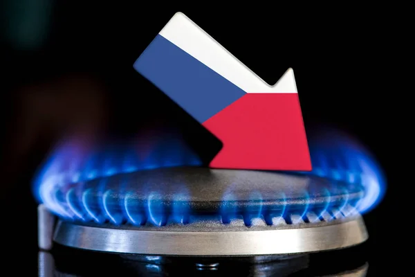 Decreased gas supplies in Czech Republic. A gas stove with a burning flame and an arrow in the colors of the Czech Republic flag pointing down. Concept of crisis in winter and lack of natural gas