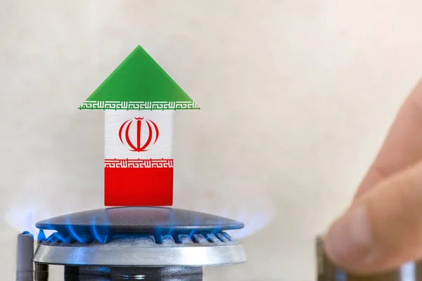 Gas price. Rise in gas prices in Iran. A burner with a flame and an arrow up, painted in the colors of the Iran flag. The concept of rising gas or energy prices