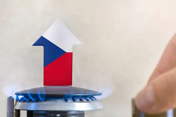 Gas price. Rise in gas prices in Czech Republic. A burner with a flame and an arrow up, painted in the colors of the Czech Republic flag. The concept of rising gas or energy prices