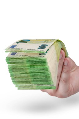 Stack of money in hand isolated on white background. 100 euro banknotes in a mans hand. A man holds out his hand with a stack of banknotes as a concept for a loan, insurance or mortgage