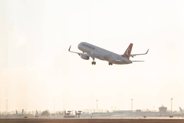 KYIV, UKRAINE - JANUARY 20, 2022: Turkish airlines aircraft departs from Boryspil international airport.  Modern passenger airplane Airbus A321 take off.