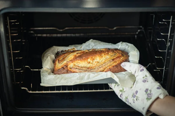 Woman Wearing Potholder Taking Fresh Banana Bread Out Oven Close — 스톡 사진