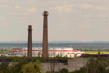 Industrial zone, the outskirts of a small town. Chimney or chimney, chimney, chimney