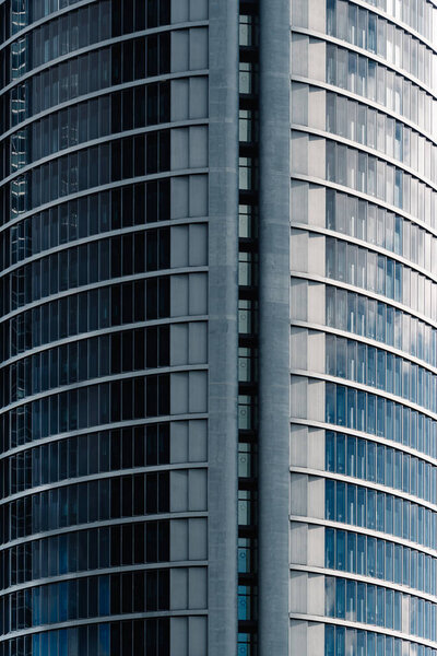 Madrid, Spain - December 5, 2021: PWC Tower in Cuatro Torres Business Area. Detail of facade